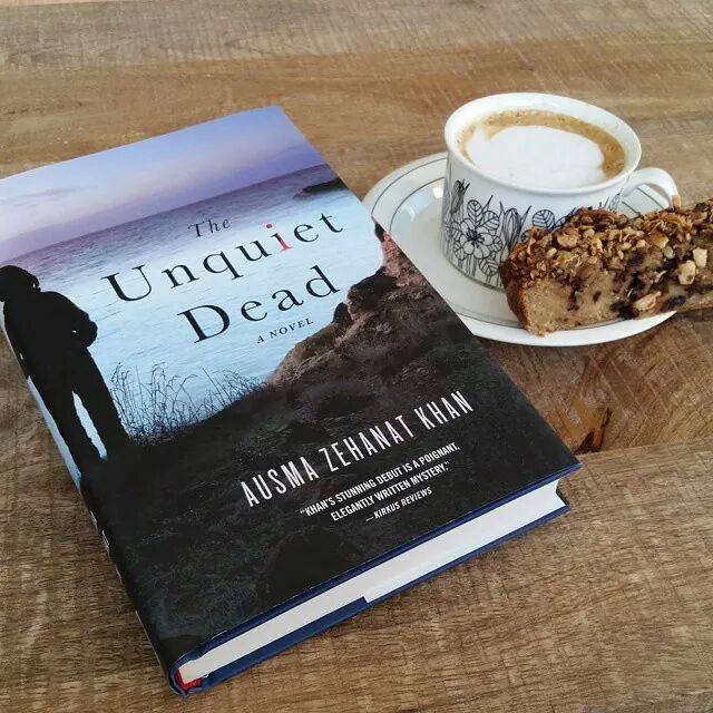 The Unquiet Dead book next to coffee, links to Instagram